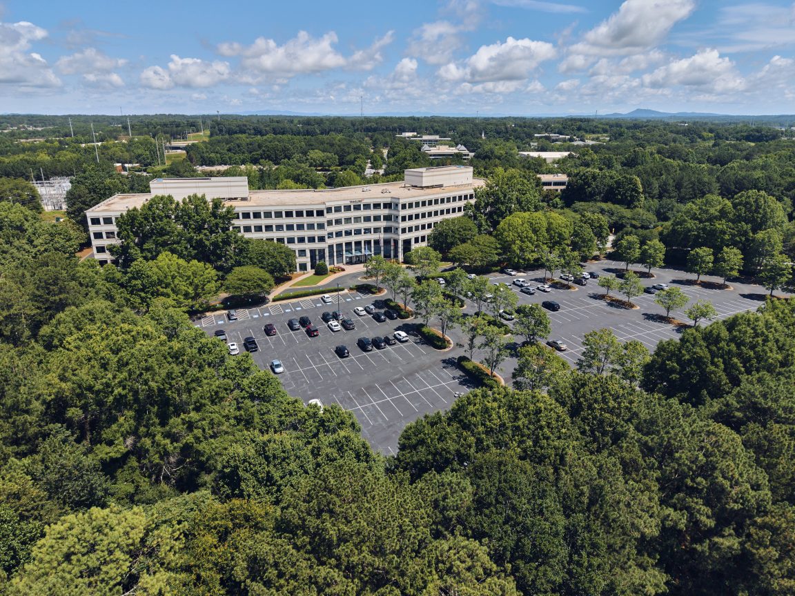 A large-scale office building and parking lot in Alpharetta.